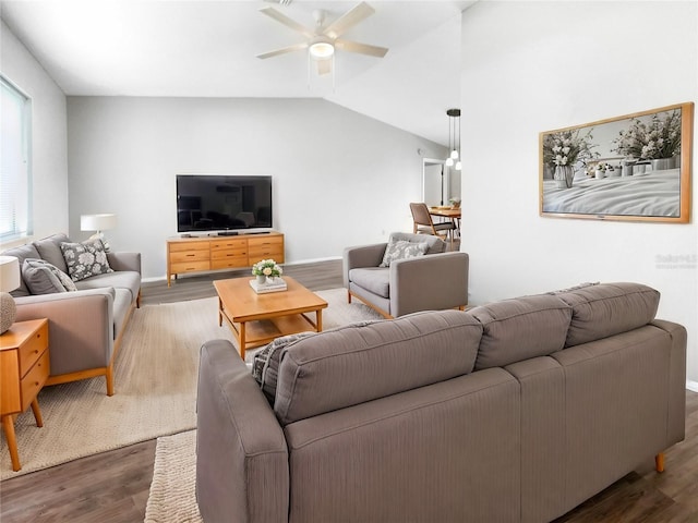 living room featuring wood-type flooring, vaulted ceiling, and ceiling fan