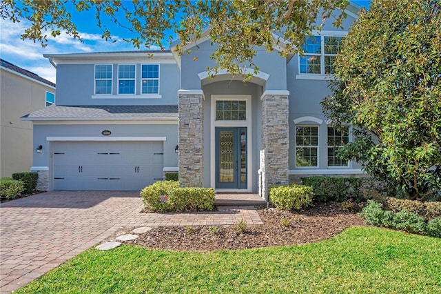 front facade with a garage