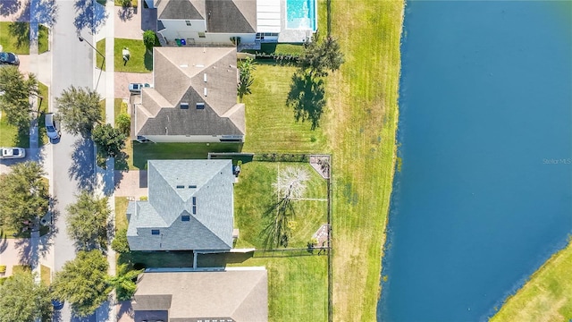 birds eye view of property with a water view