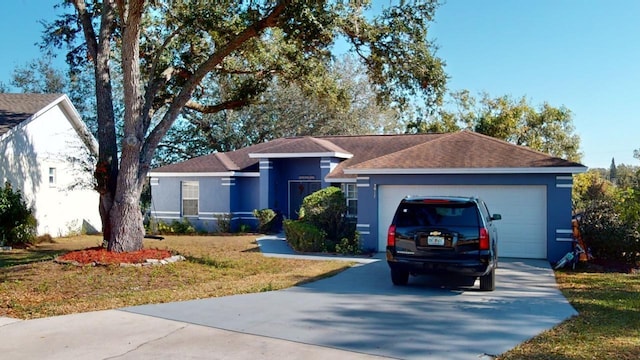 single story home with a front lawn and a garage