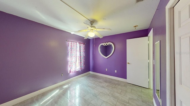 unfurnished bedroom featuring ceiling fan