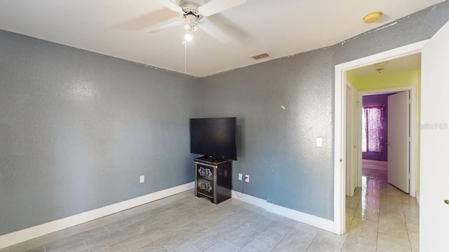 unfurnished living room featuring ceiling fan