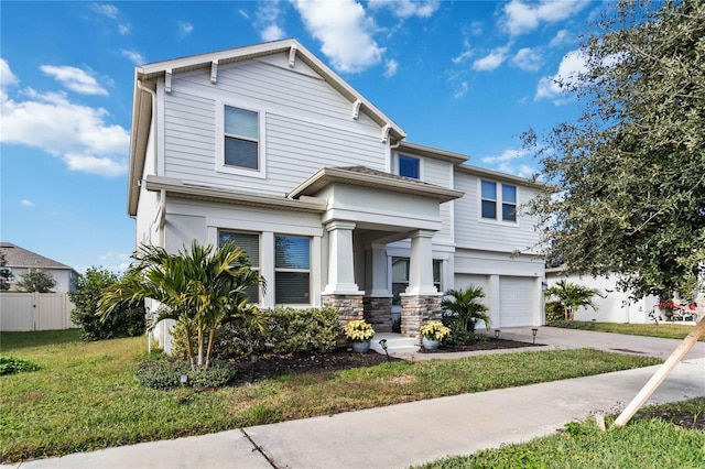 view of front of home featuring a front lawn and a garage