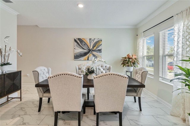 dining room featuring ornamental molding