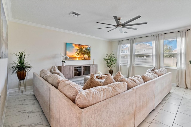 living room with a textured ceiling, ceiling fan, and crown molding