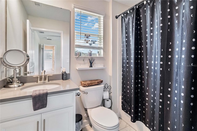 bathroom featuring toilet, walk in shower, and sink