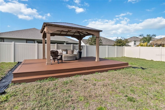 wooden terrace with a gazebo, an outdoor living space, and a yard