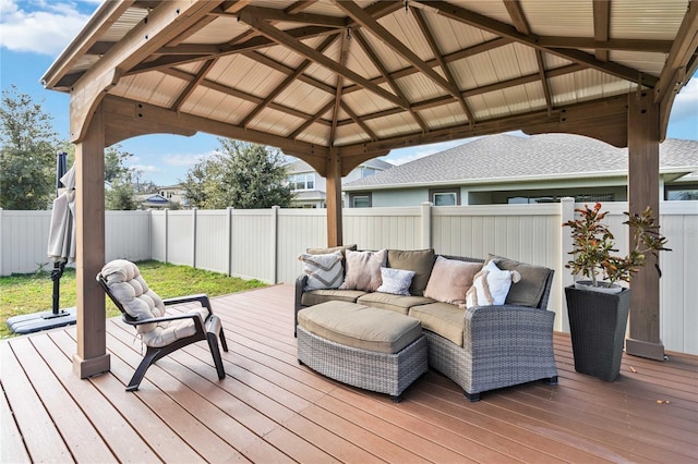 wooden terrace with a gazebo and outdoor lounge area