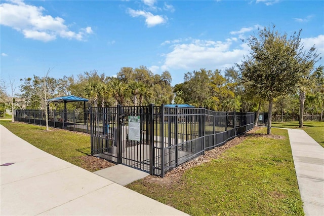 view of property's community with a yard