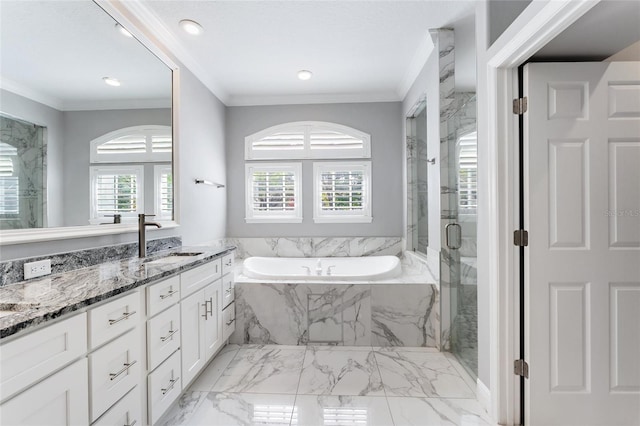 bathroom with crown molding, vanity, and shower with separate bathtub