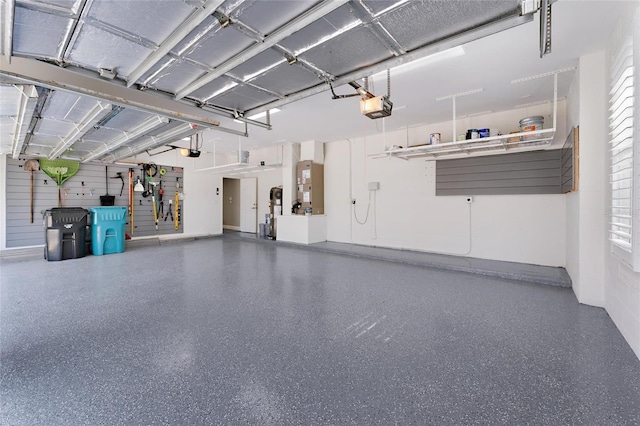 garage featuring a garage door opener and heating unit