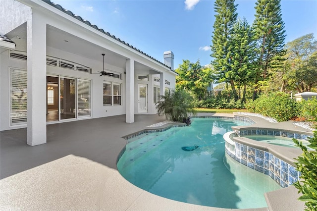 view of swimming pool featuring an in ground hot tub, ceiling fan, and a patio