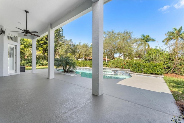 view of pool with a patio and ceiling fan