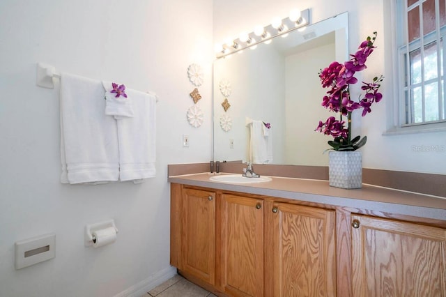 bathroom with vanity and tile patterned flooring