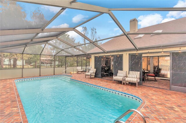 pool featuring a patio area and a lanai