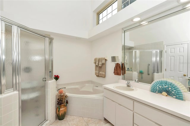 full bath with tile patterned flooring, a shower stall, vanity, and a bath