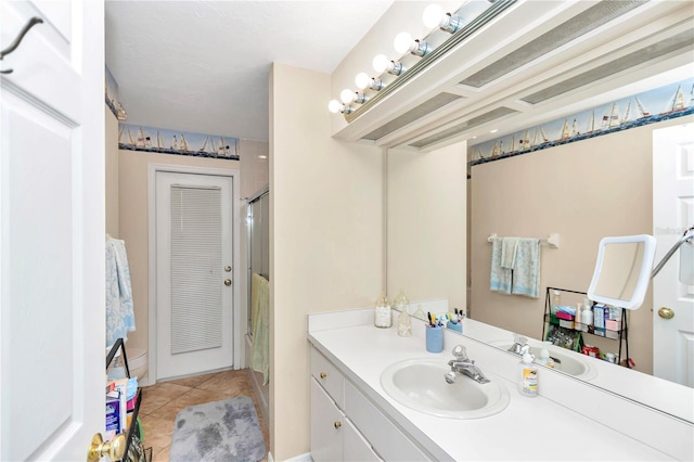 full bath with tile patterned flooring, a shower stall, and vanity