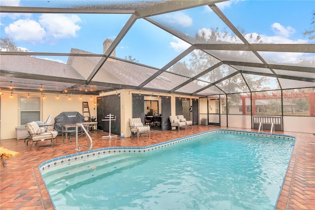 outdoor pool featuring an outdoor hangout area and a patio area