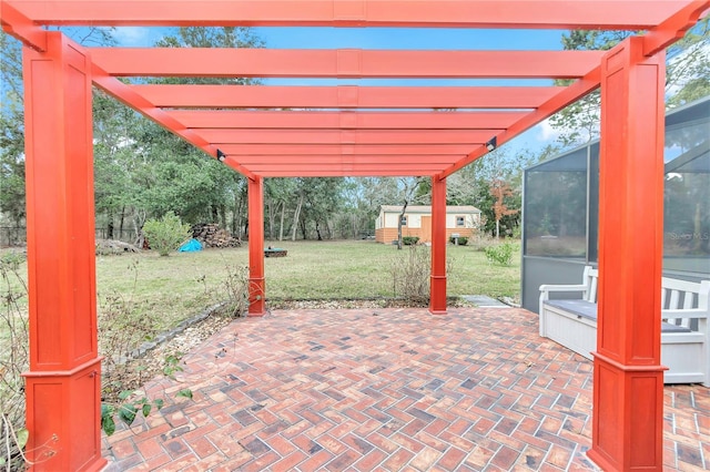 view of patio featuring an outbuilding and a pergola