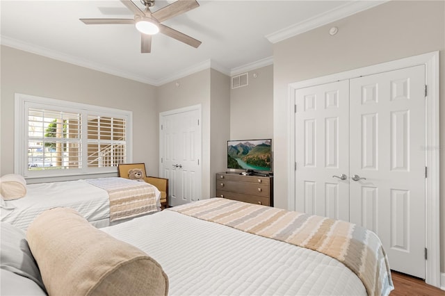 bedroom featuring ornamental molding, ceiling fan, and hardwood / wood-style floors