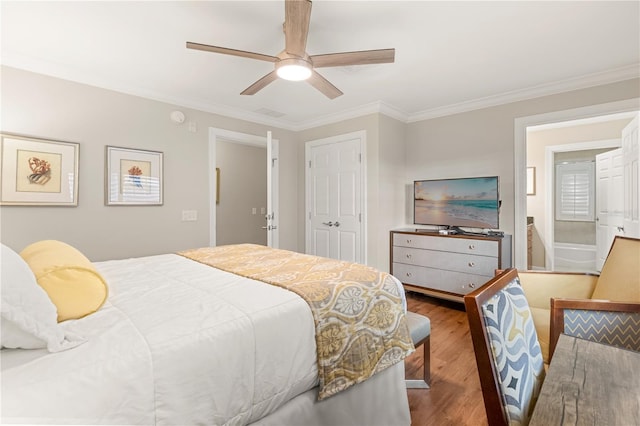 bedroom featuring ceiling fan, hardwood / wood-style flooring, and crown molding