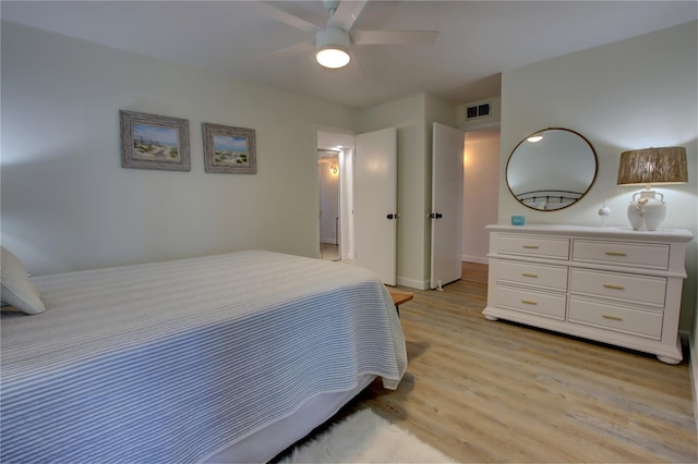 bedroom featuring ceiling fan and light hardwood / wood-style floors