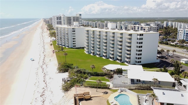 aerial view featuring a view of the beach and a water view