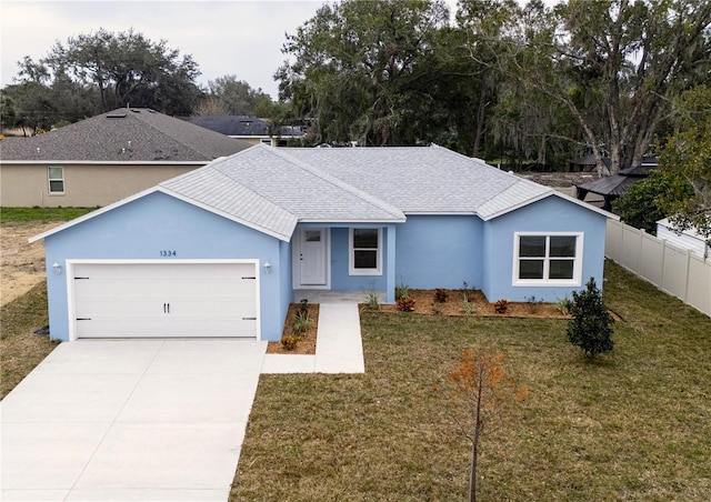 single story home with a front lawn and a garage