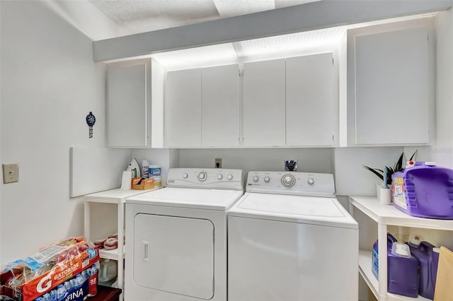 washroom with cabinets and separate washer and dryer