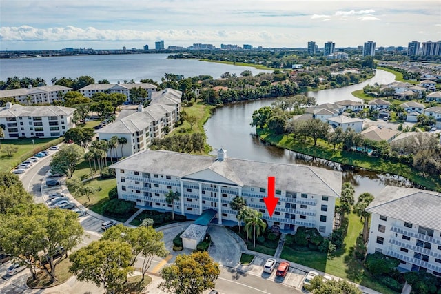 birds eye view of property with a water view