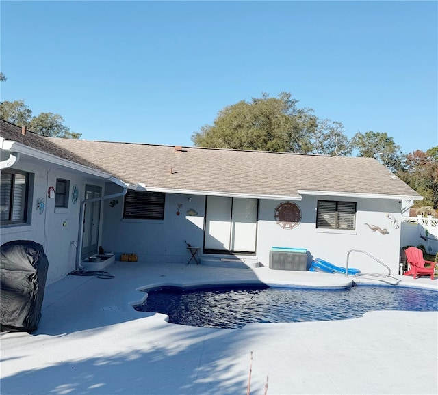 back of property with a patio area