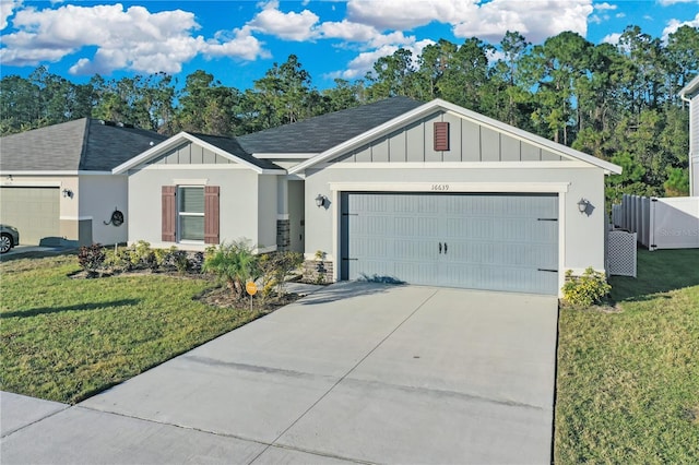 ranch-style home featuring a front lawn and a garage