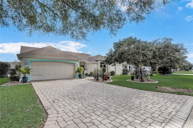 single story home featuring a front yard and a garage