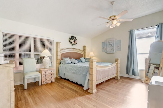 bedroom featuring hardwood / wood-style flooring, ceiling fan, and vaulted ceiling