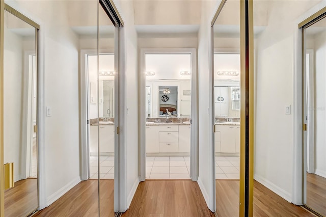 hall with light hardwood / wood-style floors