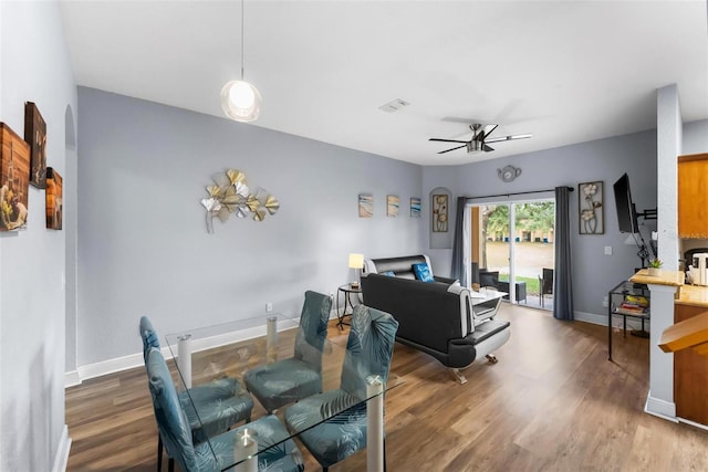 dining space featuring hardwood / wood-style flooring and ceiling fan