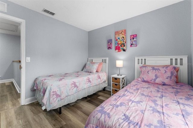 bedroom with hardwood / wood-style flooring