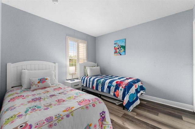 bedroom with hardwood / wood-style floors