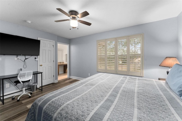 bedroom with ceiling fan, ensuite bathroom, and dark wood-type flooring