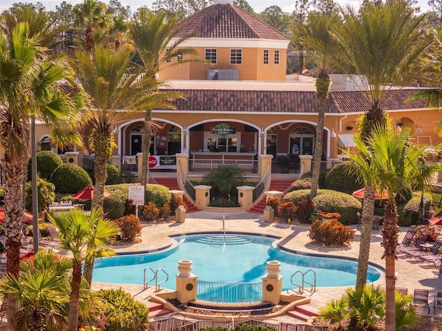 view of swimming pool featuring a patio