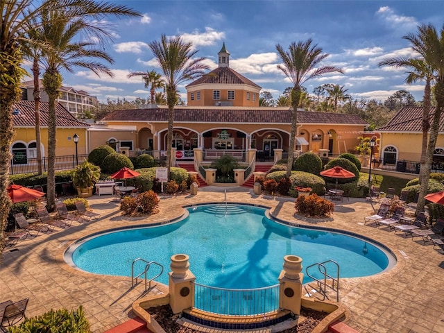 view of swimming pool featuring a patio