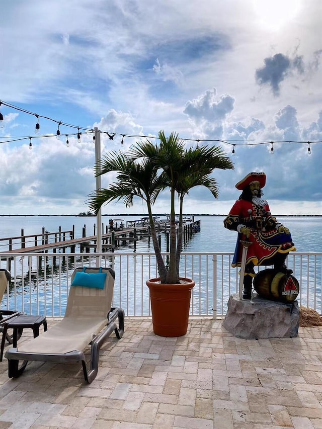 view of patio with a water view