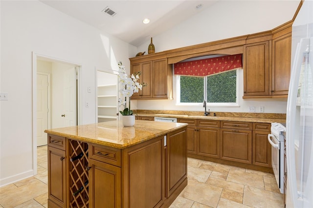 kitchen with light stone countertops, a center island, sink, white range with electric stovetop, and vaulted ceiling