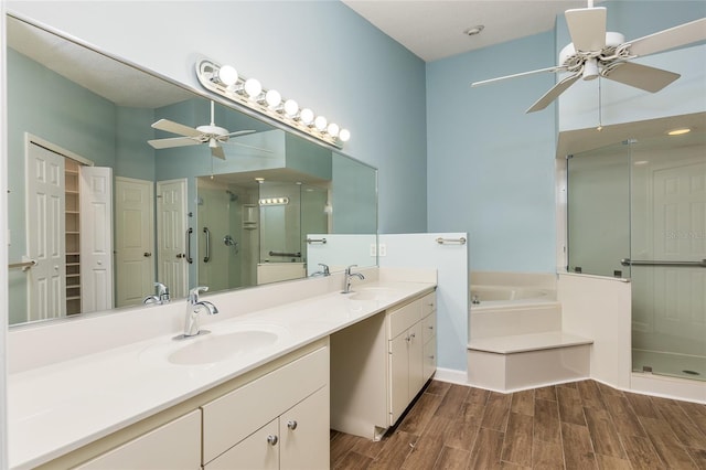 bathroom with vanity, ceiling fan, and independent shower and bath