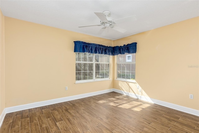 spare room featuring ceiling fan and hardwood / wood-style flooring