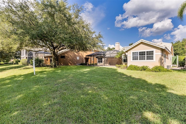 view of yard featuring a lanai