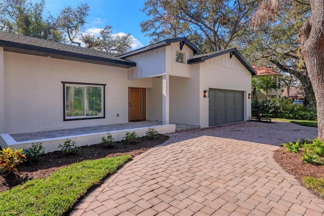 view of front of home with covered porch and a garage