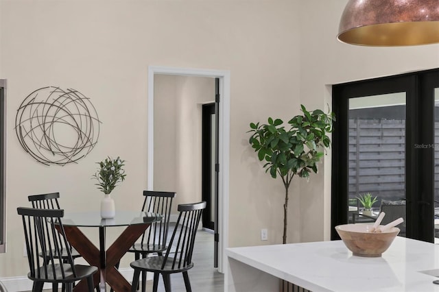 dining area with wood-type flooring