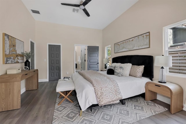 bedroom featuring ensuite bath, ceiling fan, and hardwood / wood-style floors