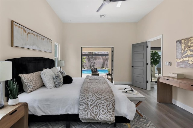 bedroom featuring access to outside, ceiling fan, and dark wood-type flooring